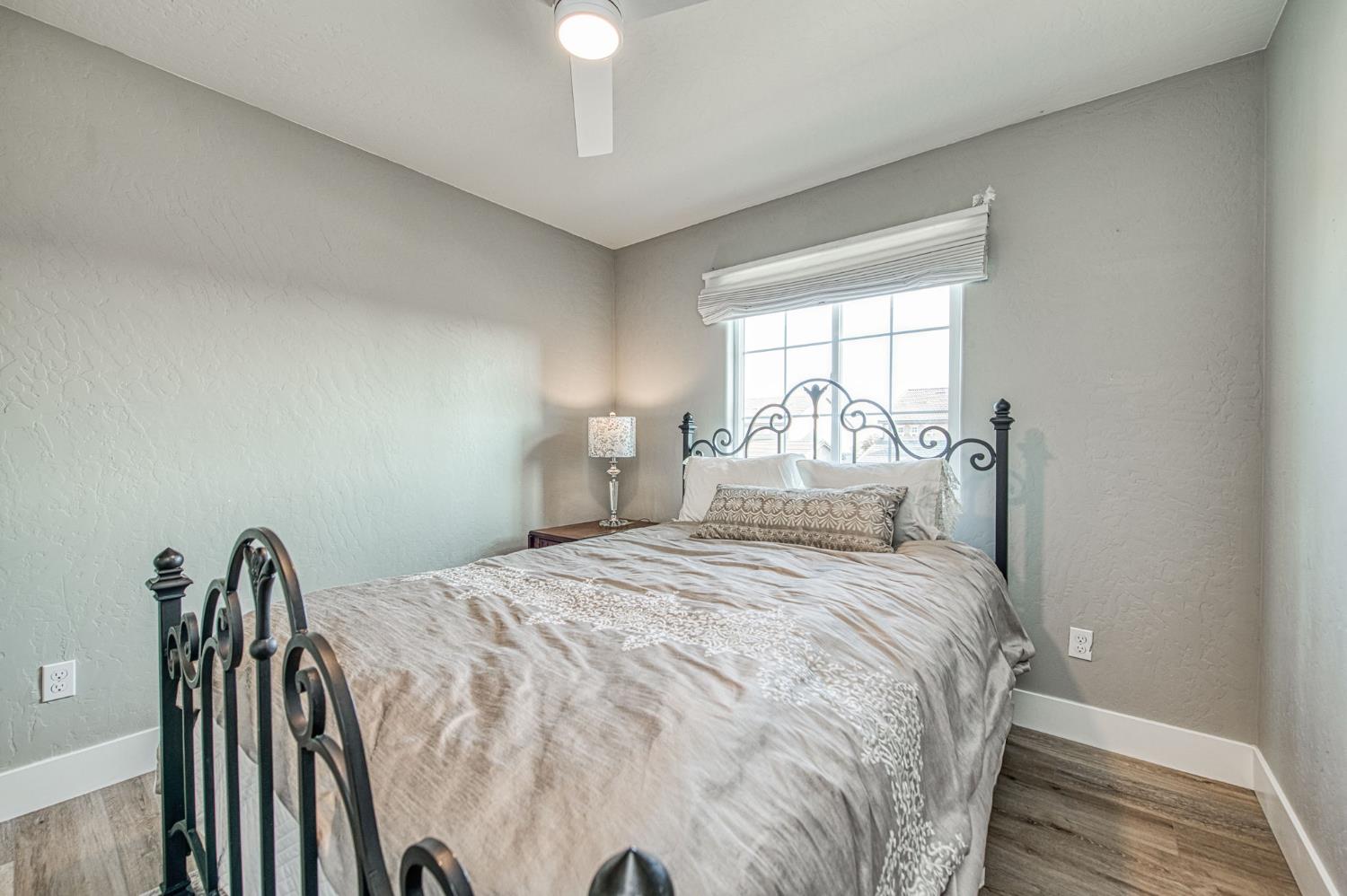 5855 East Platt Avenue Fresno, CA 93727 - Photo 52 of 57 a bedroom with a bed and a window