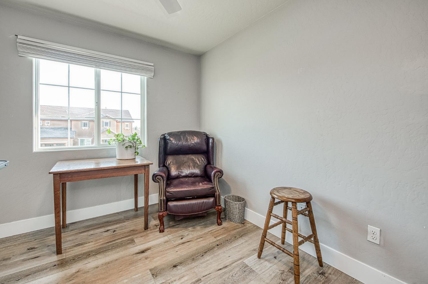 5855 East Platt Avenue Fresno, CA 93727 - Photo 54 of 57 a living room with furniture a piano and a window