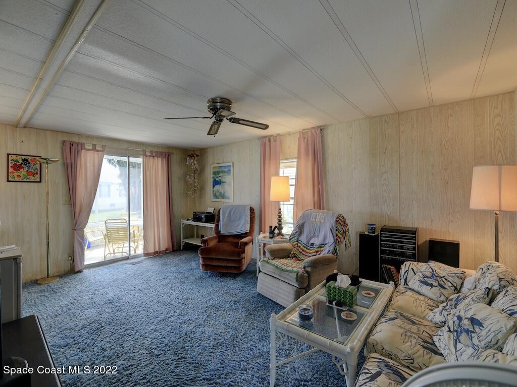 939 Laurel Circle Barefoot Bay, FL 32976 - Photo 12 of 36 a living room with furniture and a window