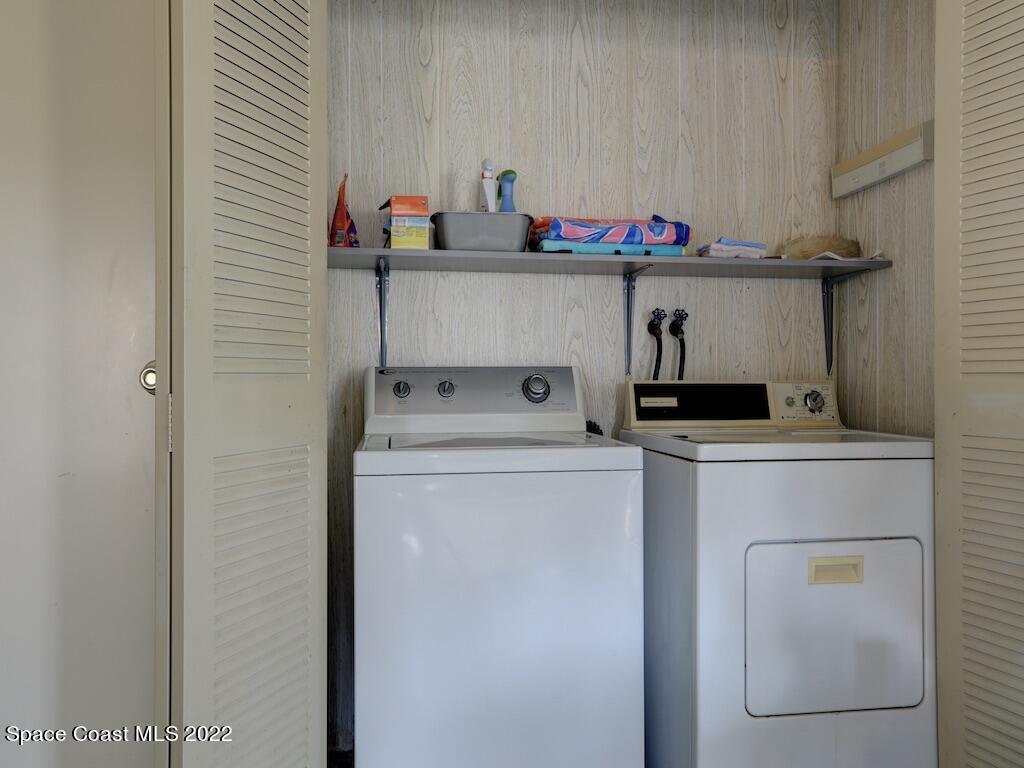939 Laurel Circle Barefoot Bay, FL 32976 - Photo 28 of 36 a utility room with dryer and washer