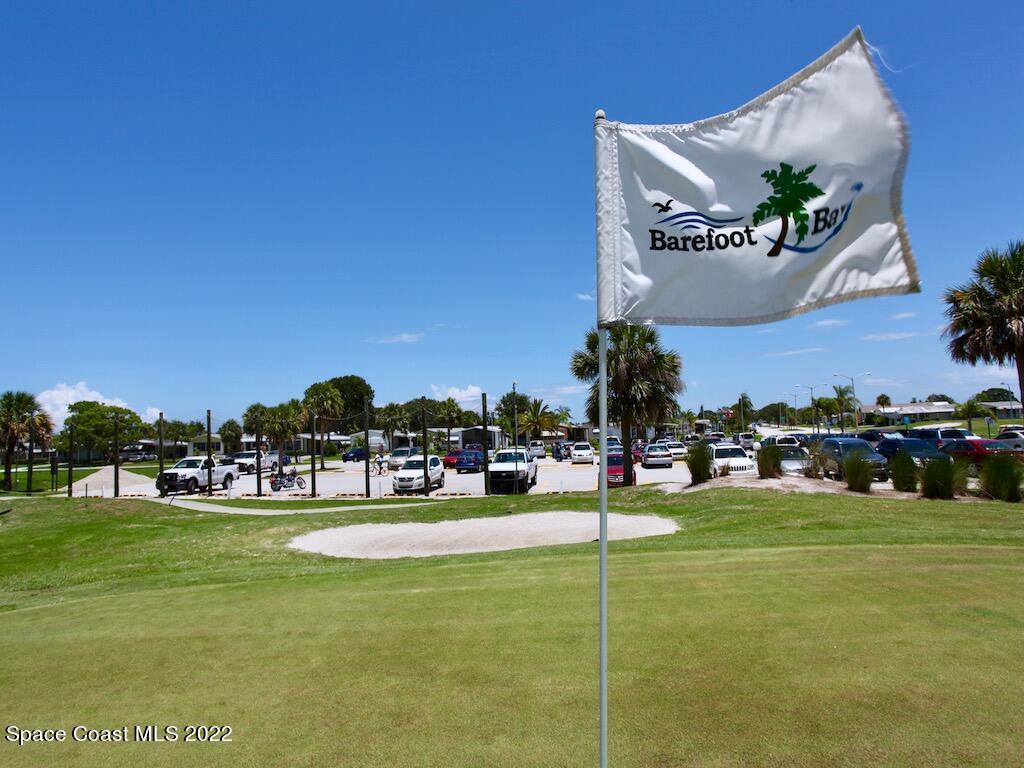 939 Laurel Circle Barefoot Bay, FL 32976 - Photo 32 of 36 a view of a playground with basketball court