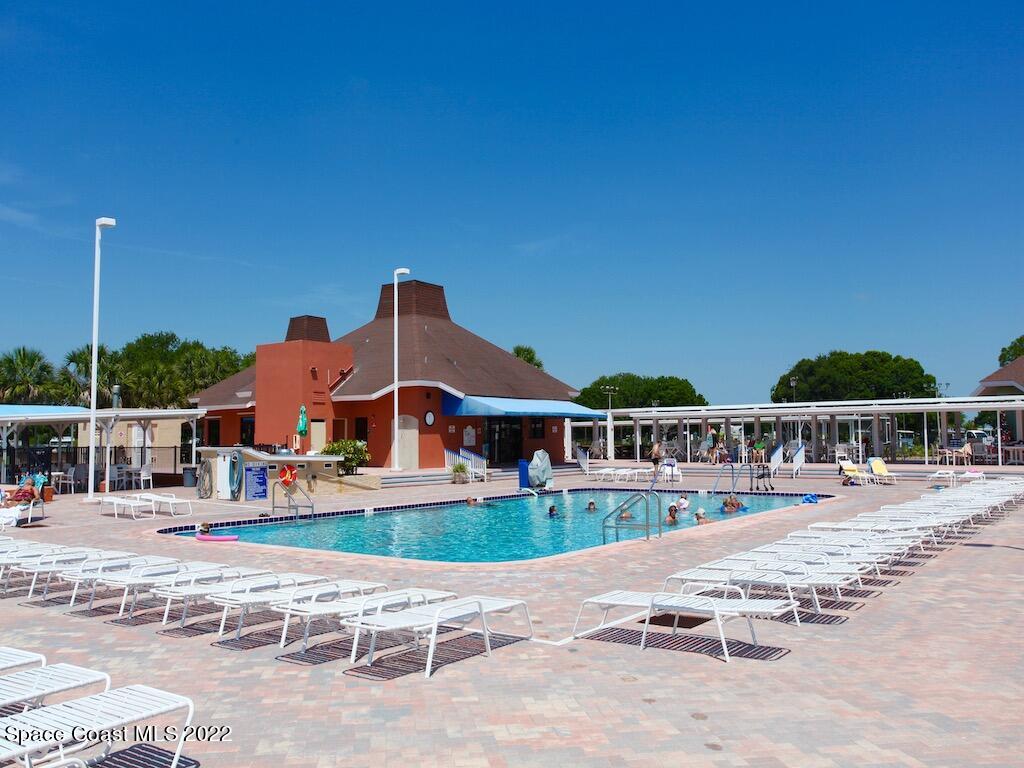 939 Laurel Circle Barefoot Bay, FL 32976 - Photo 35 of 36 a front view of a house with swimming pool