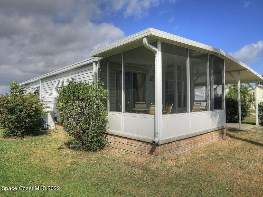 939 Laurel Circle Barefoot Bay, FL 32976 - Photo 5 of 36 a view of a entryway in front of house