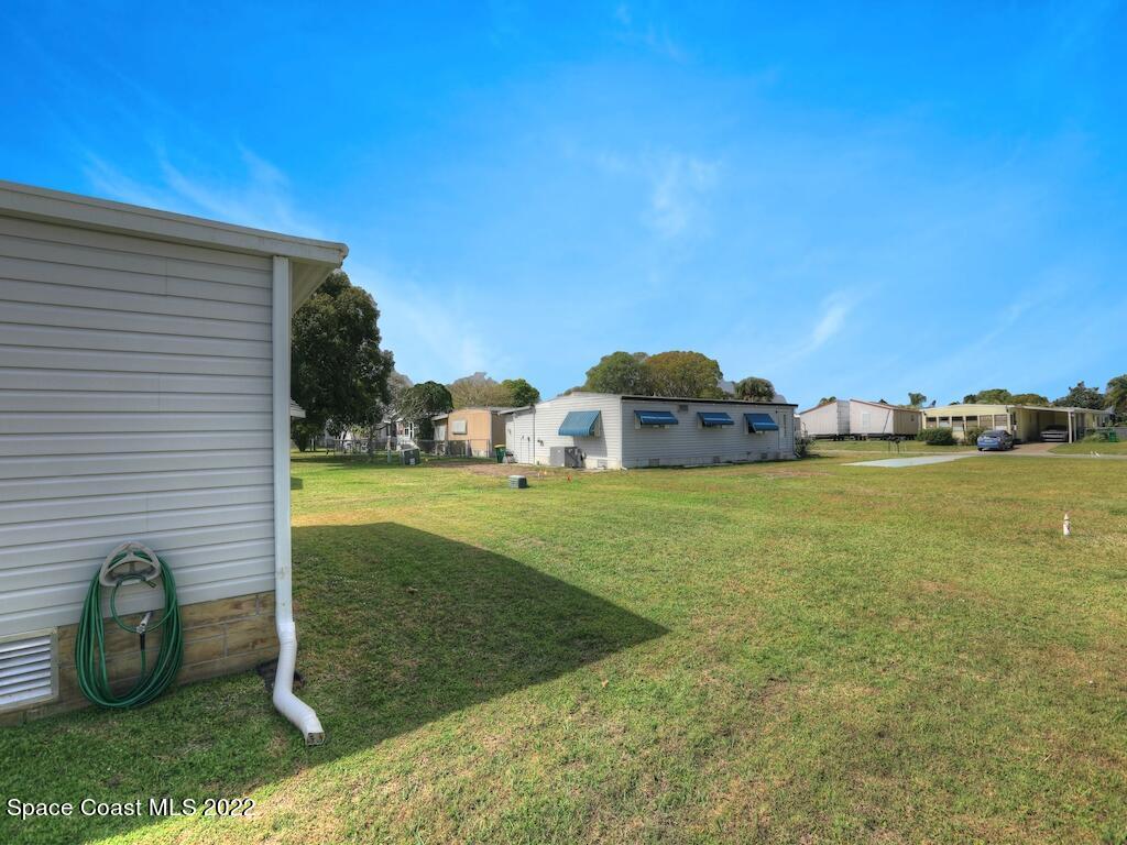 939 Laurel Circle Barefoot Bay, FL 32976 - Photo 7 of 36 a view of outdoor space and yard
