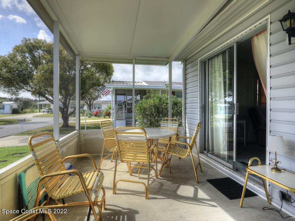 939 Laurel Circle Barefoot Bay, FL 32976 - Photo 9 of 36 a view of an outdoor space with seating area