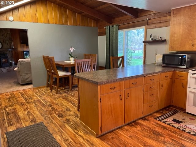 40553 Little Fall Creek Road Fall Creek, OR 97438 - Photo 13 of 28 a kitchen with stainless steel appliances granite countertop a sink and a refrigerator