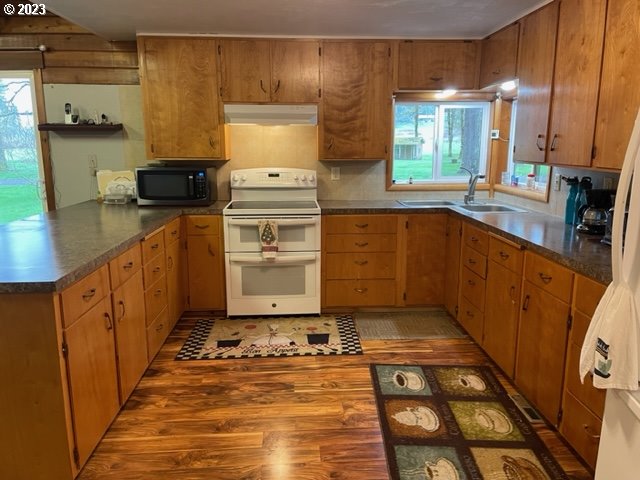 40553 Little Fall Creek Road Fall Creek, OR 97438 - Photo 15 of 28 a kitchen with stainless steel appliances a stove a sink and a microwave