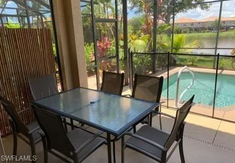 a view of a chairs and table in the balcony