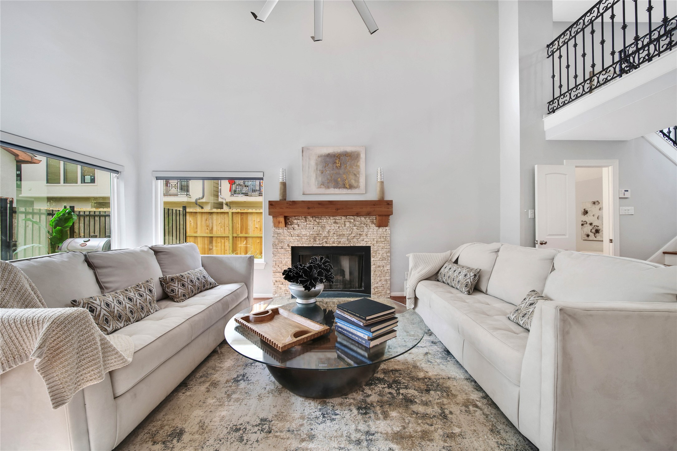 1937 Norfolk Street Houston, TX 77098 - Photo 8 of 41 a living room with furniture a fireplace and a large window