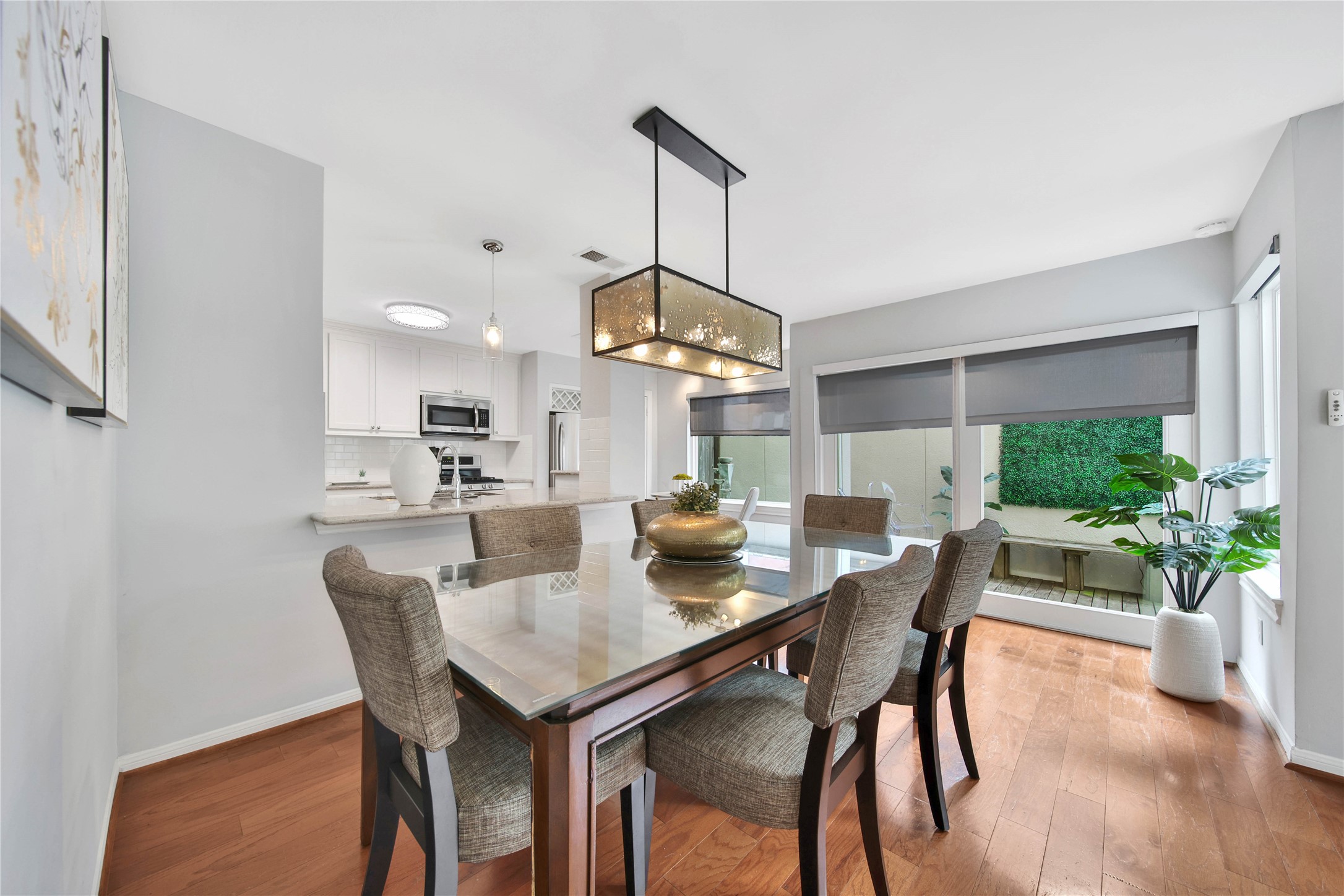 1937 Norfolk Street Houston, TX 77098 - Photo 10 of 41 a view of a dining room with furniture and wooden floor