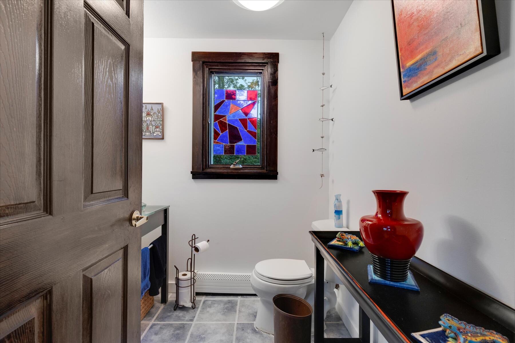 36 Cranberry Way Wellfleet, MA 02667 - Photo 23 of 64 a bathroom with a toilet a sink and a mirror