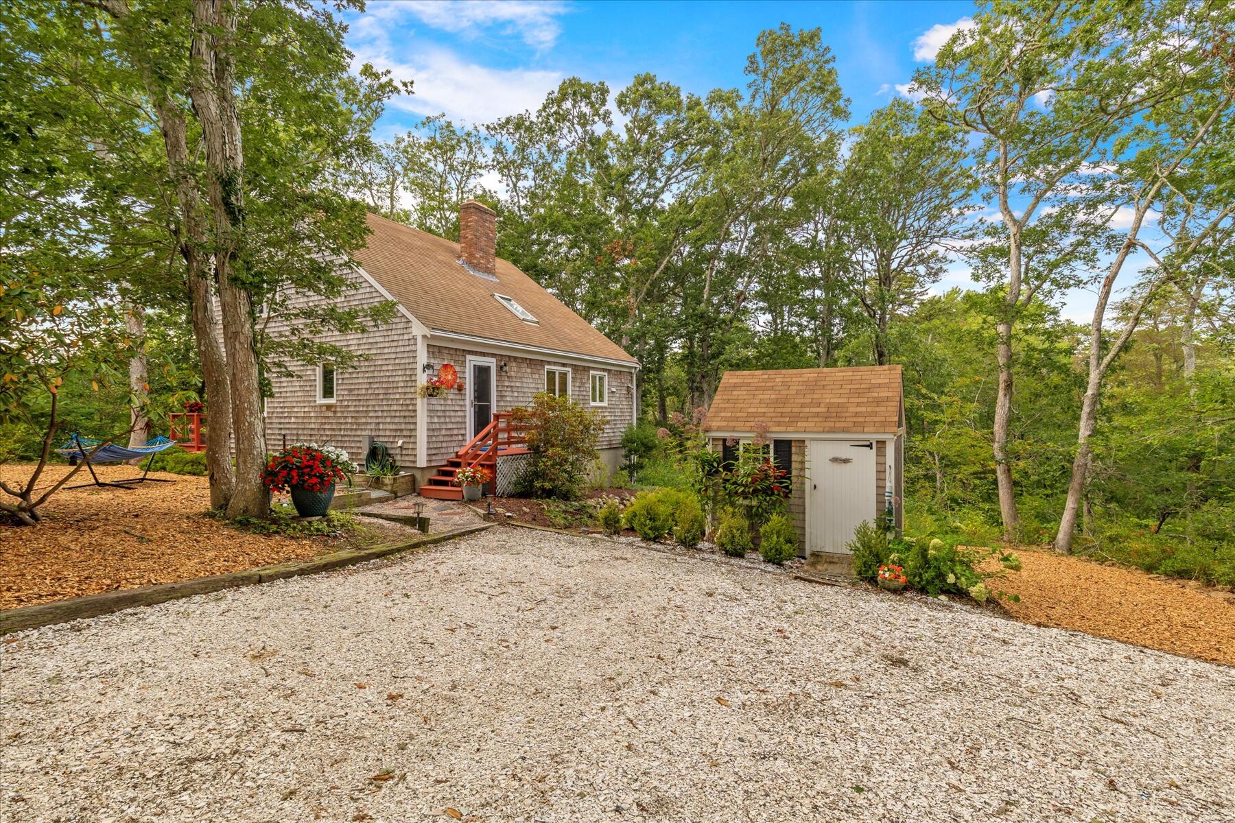 36 Cranberry Way Wellfleet, MA 02667 - Photo 3 of 64 a view of a road with a tree in front of it