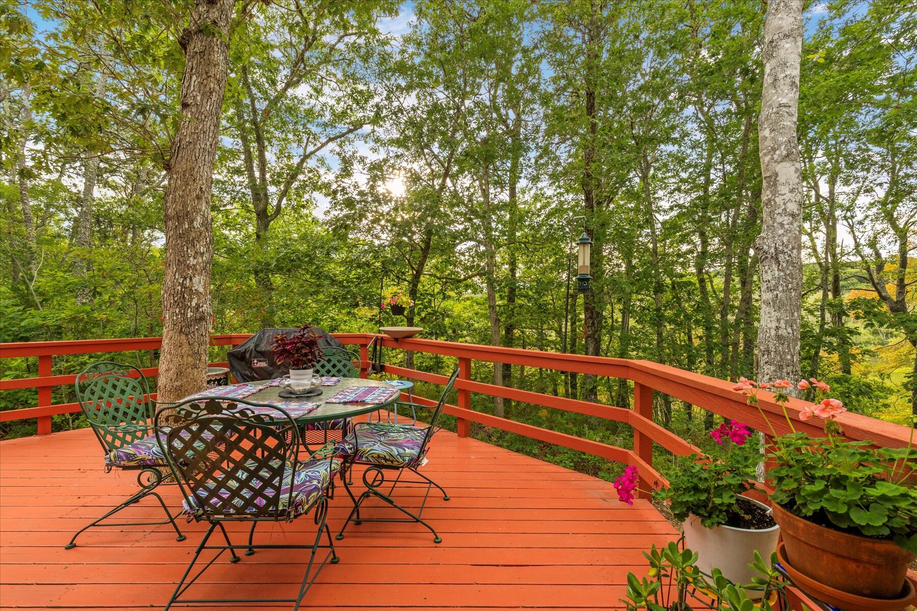 36 Cranberry Way Wellfleet, MA 02667 - Photo 34 of 64 a view of a chairs and table on the wooden deck