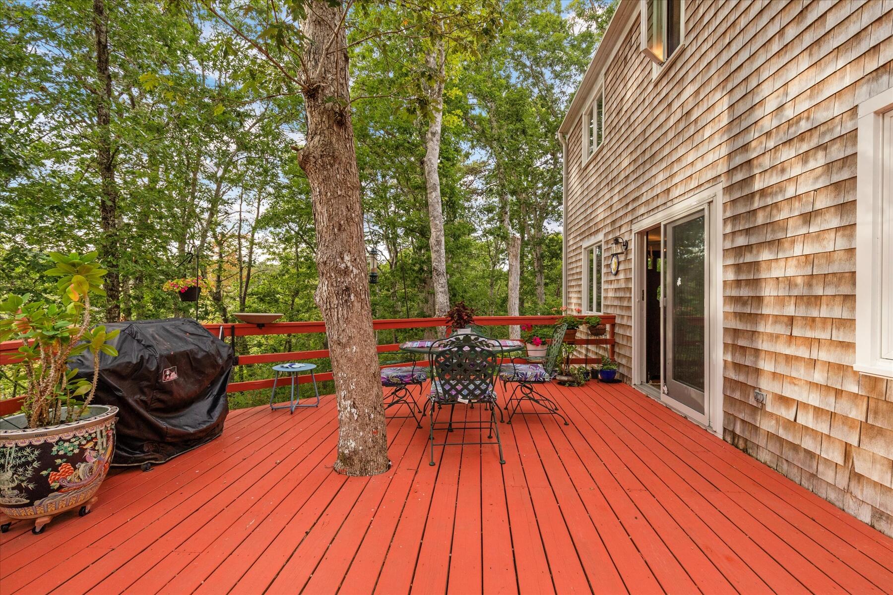 36 Cranberry Way Wellfleet, MA 02667 - Photo 35 of 64 a view of a patio with table and chairs and wooden floor