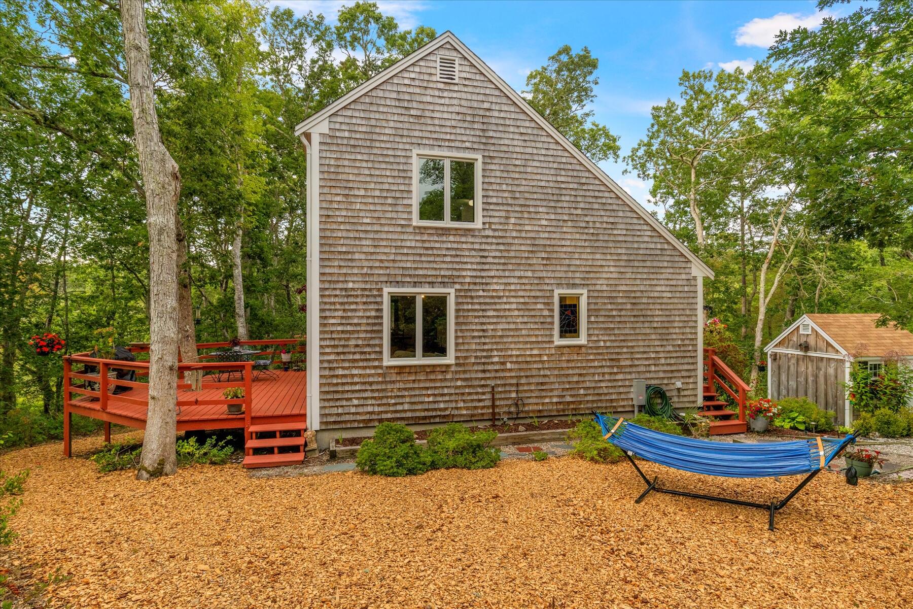 36 Cranberry Way Wellfleet, MA 02667 - Photo 4 of 64 a view of a house with a yard and furniture