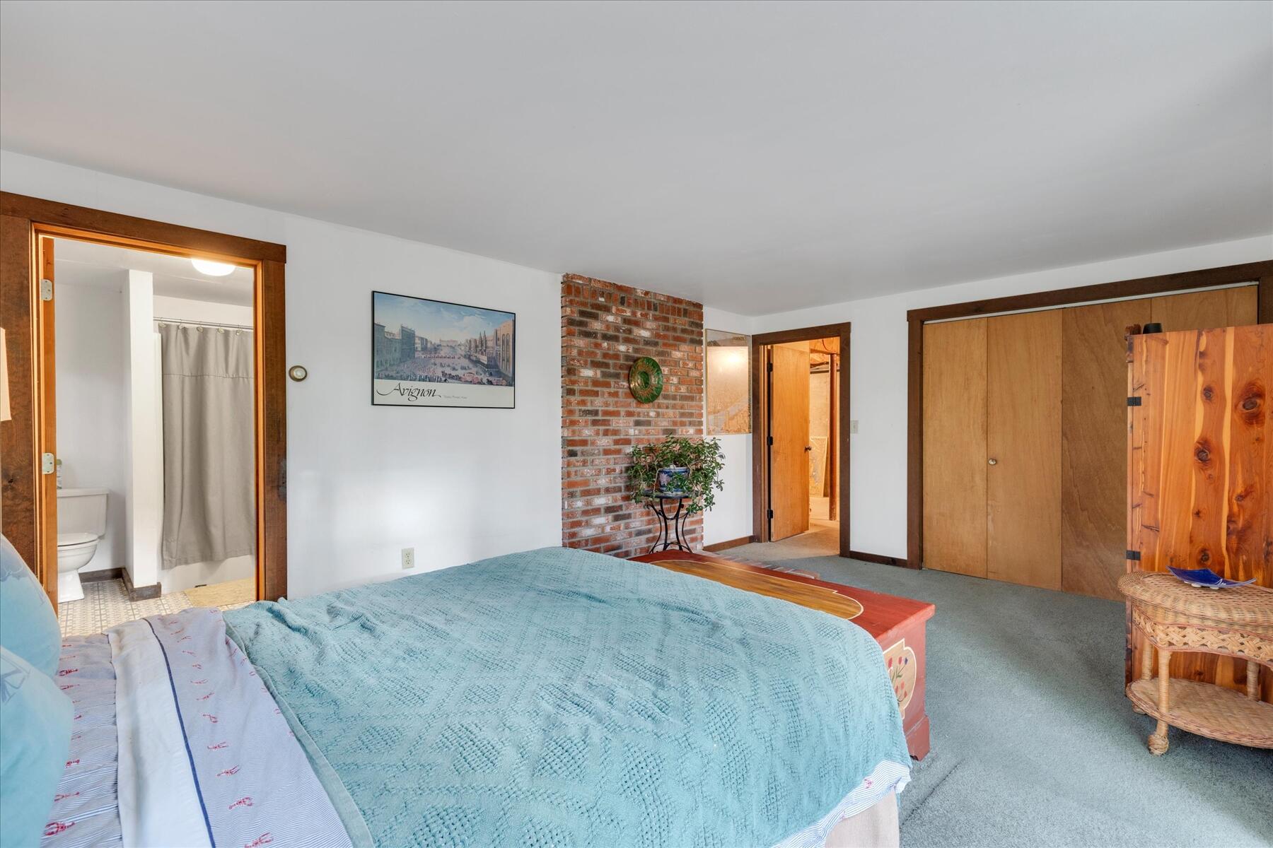 36 Cranberry Way Wellfleet, MA 02667 - Photo 41 of 64 a bedroom with a large window and a bed