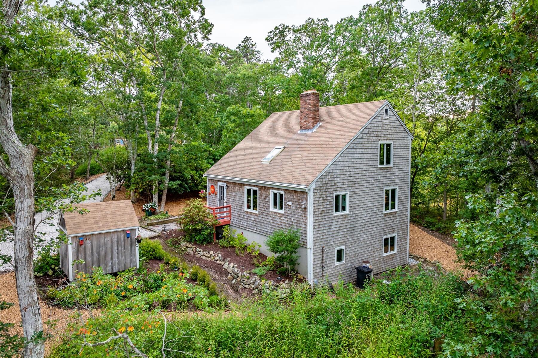 36 Cranberry Way Wellfleet, MA 02667 - Photo 57 of 64 a aerial view of a house with yard and trees in the background