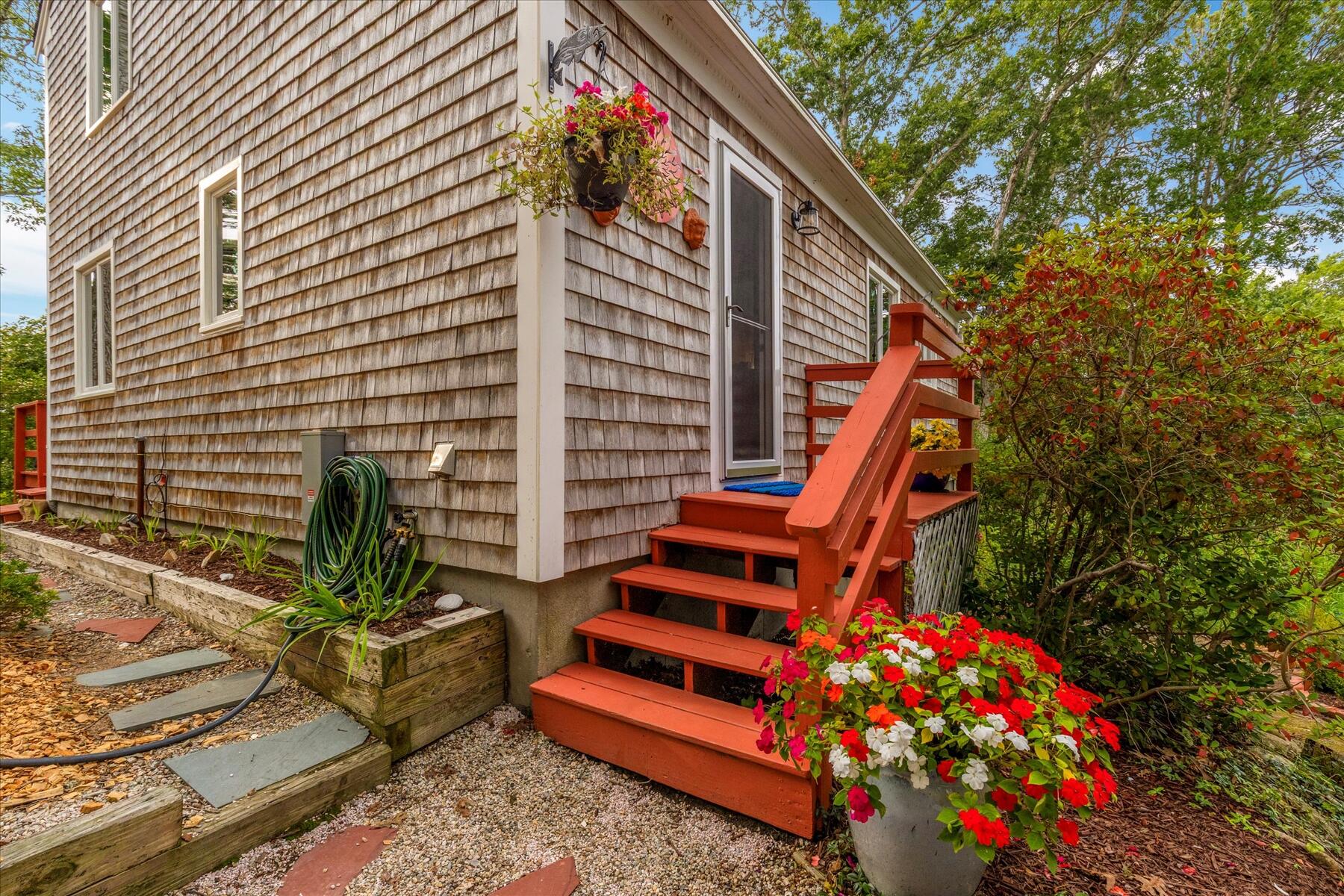 36 Cranberry Way Wellfleet, MA 02667 - Photo 8 of 64 a backyard of a house with seating space