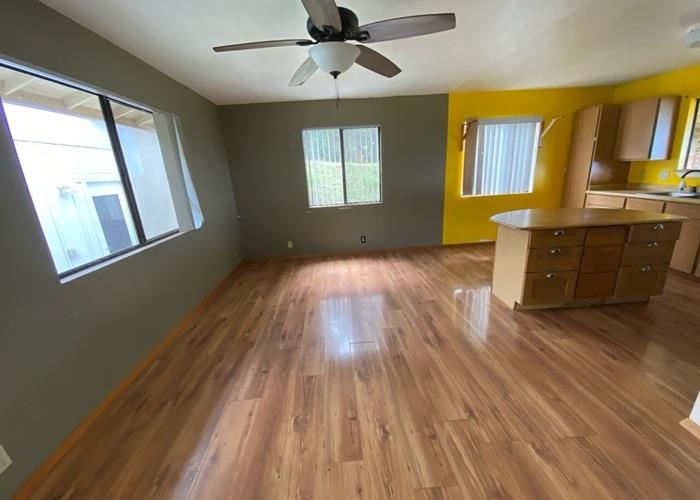 5702 Lower Kula Road Kula, HI 96790 - Photo 12 of 20 a view of empty room with wooden floor and fan