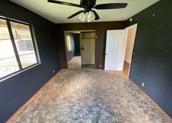 5702 Lower Kula Road Kula, HI 96790 - Photo 13 of 20 a bedroom with a bed and a window