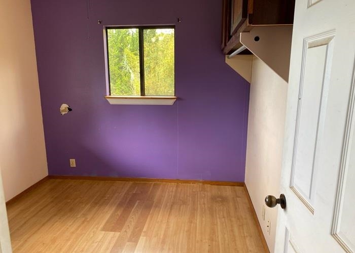 5702 Lower Kula Road Kula, HI 96790 - Photo 15 of 20 a view of a room with wooden floor and a window