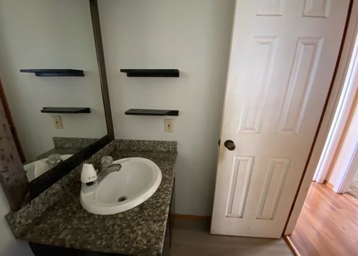 5702 Lower Kula Road Kula, HI 96790 - Photo 18 of 20 a bathroom with a sink and a mirror