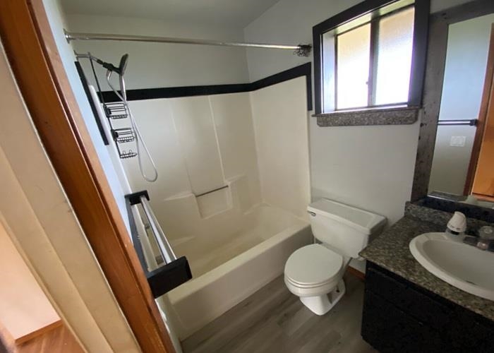 5702 Lower Kula Road Kula, HI 96790 - Photo 20 of 20 a bathroom with a granite countertop sink toilet and shower