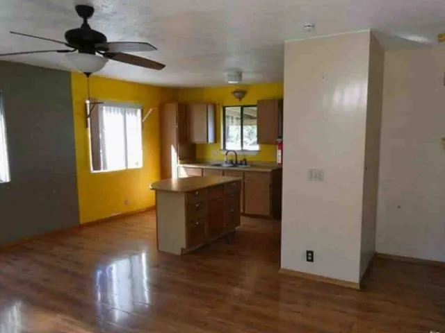 a kitchen with a refrigerator and a sink