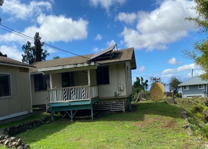 5702 Lower Kula Road Kula, HI 96790 - Photo 4 of 20 a view of a chair and table in backyard of the house