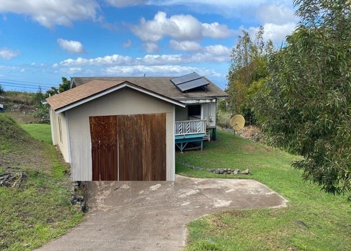 5702 Lower Kula Road Kula, HI 96790 - Photo 5 of 20 a front view of a house with a garden