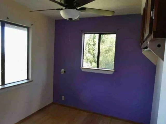a view of a room that has a window in it