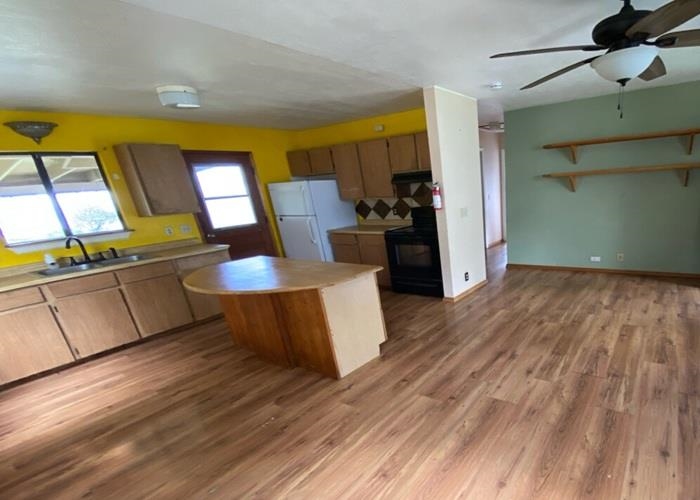 5702 Lower Kula Road Kula, HI 96790 - Photo 10 of 20 a living room with furniture and a wooden floor