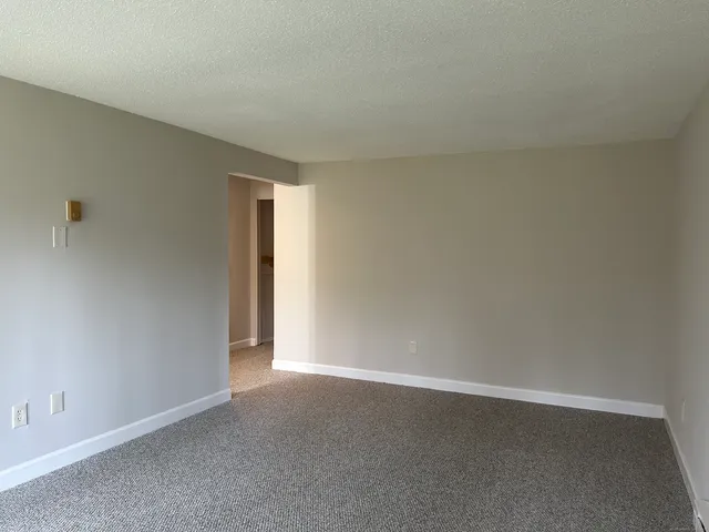 a view of an empty room and window