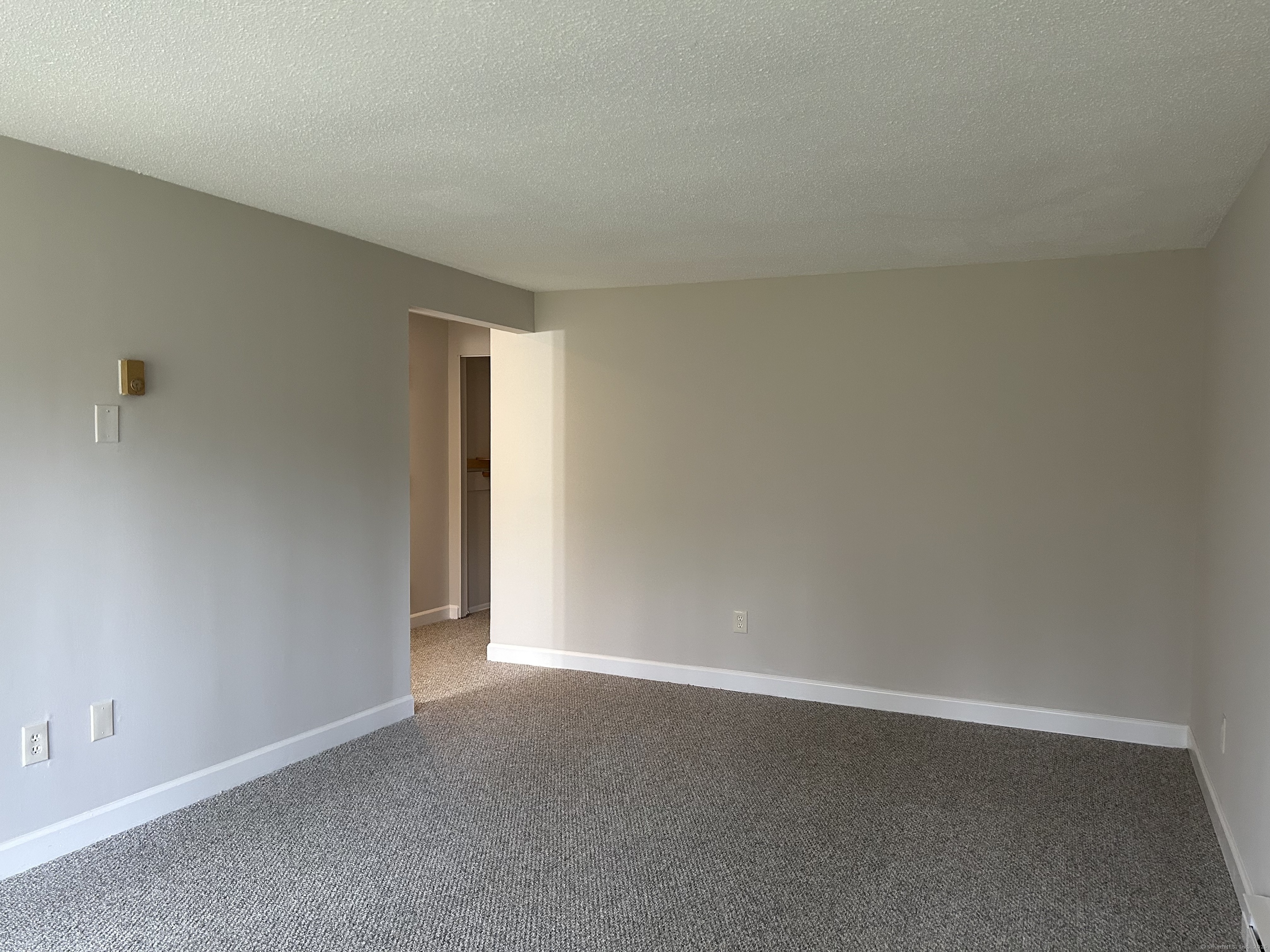 7 Padanaram Road, Unit J253 Danbury, CT 06811 - Photo 6 of 12 a view of an empty room and window