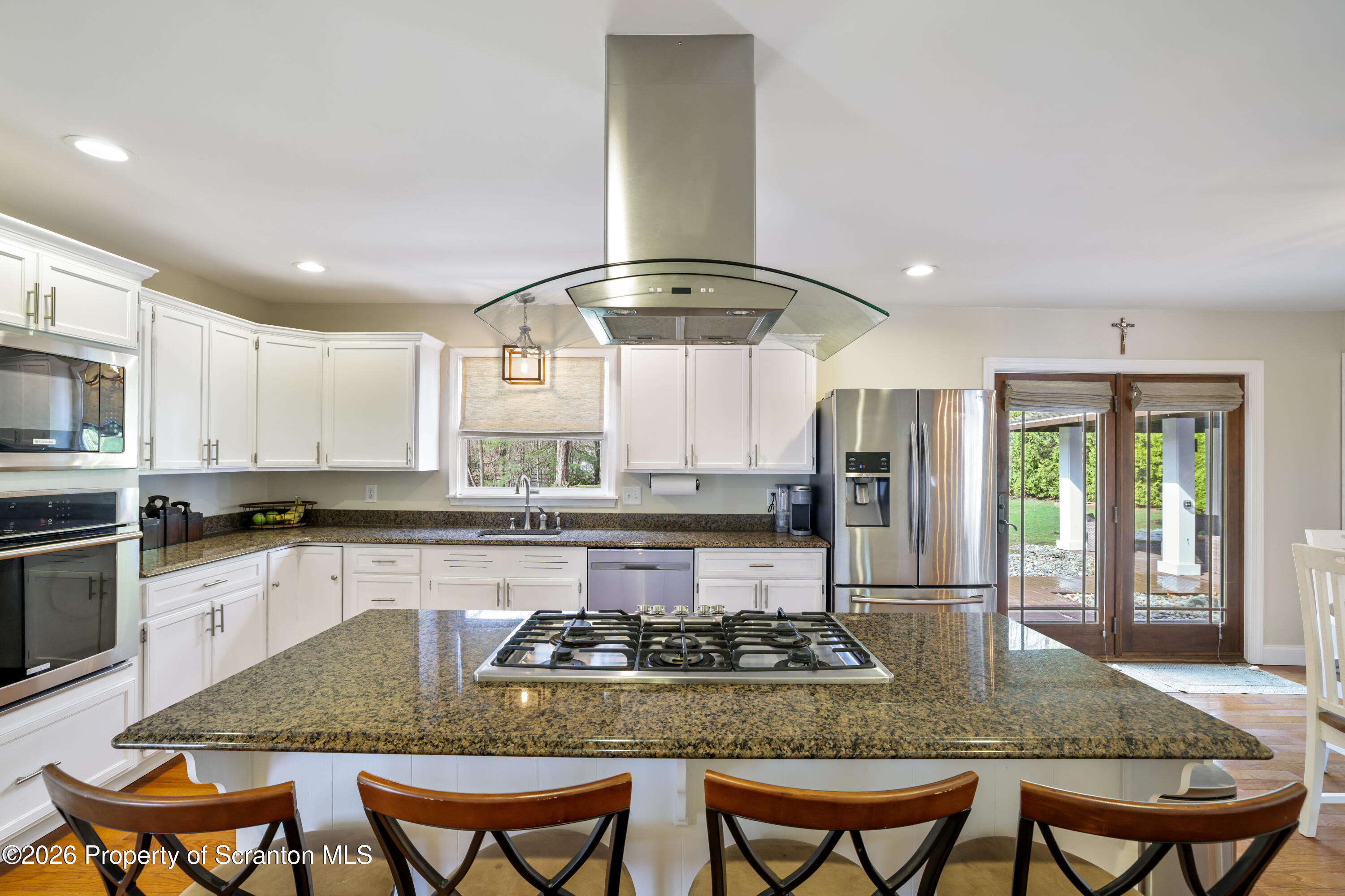 3 Old Mill Road Jermyn, PA 18433 - Photo 13 of 57 a kitchen with stainless steel appliances granite countertop a stove top oven a sink and dishwasher