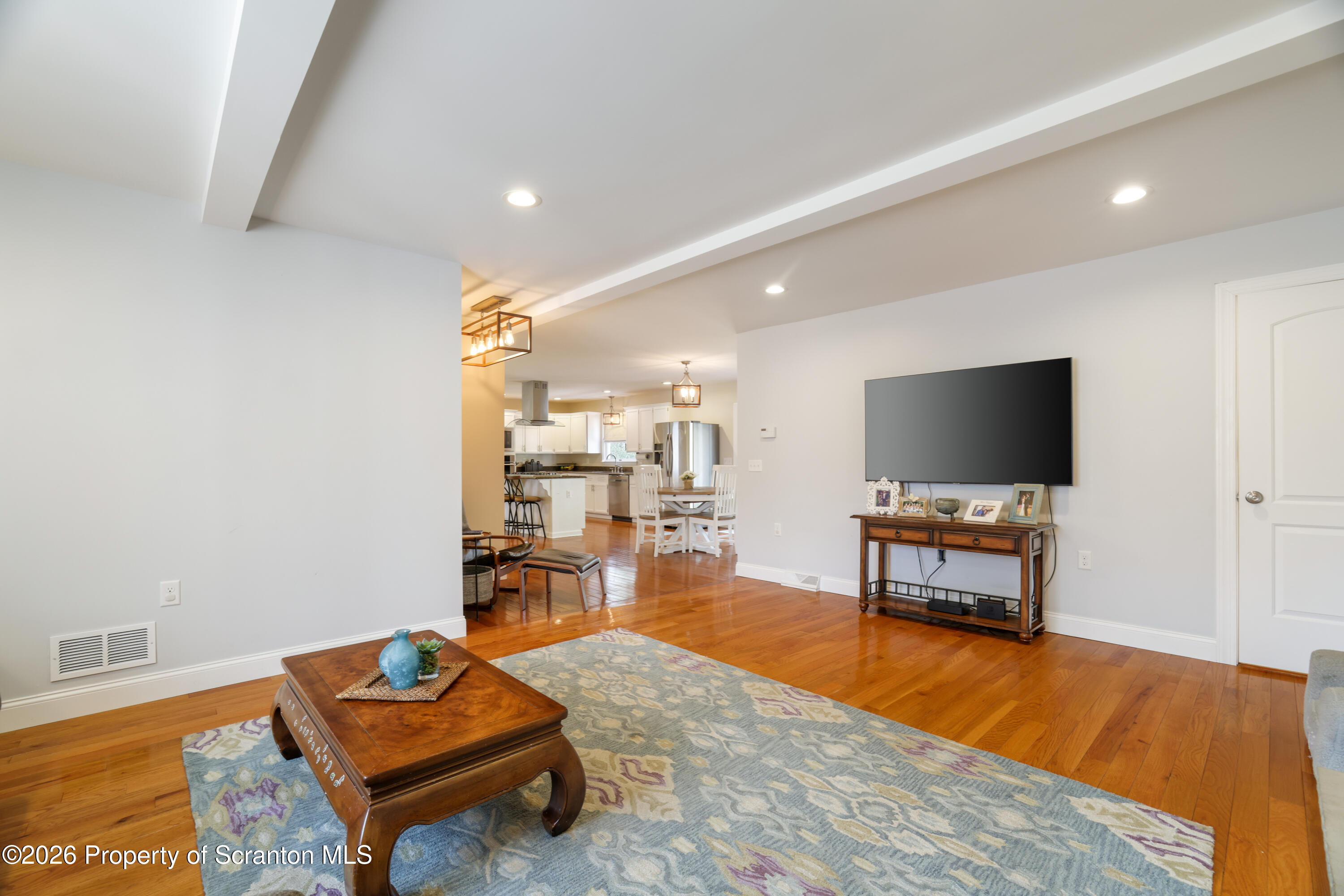 3 Old Mill Road Jermyn, PA 18433 - Photo 17 of 57 a living room with furniture and a flat screen tv