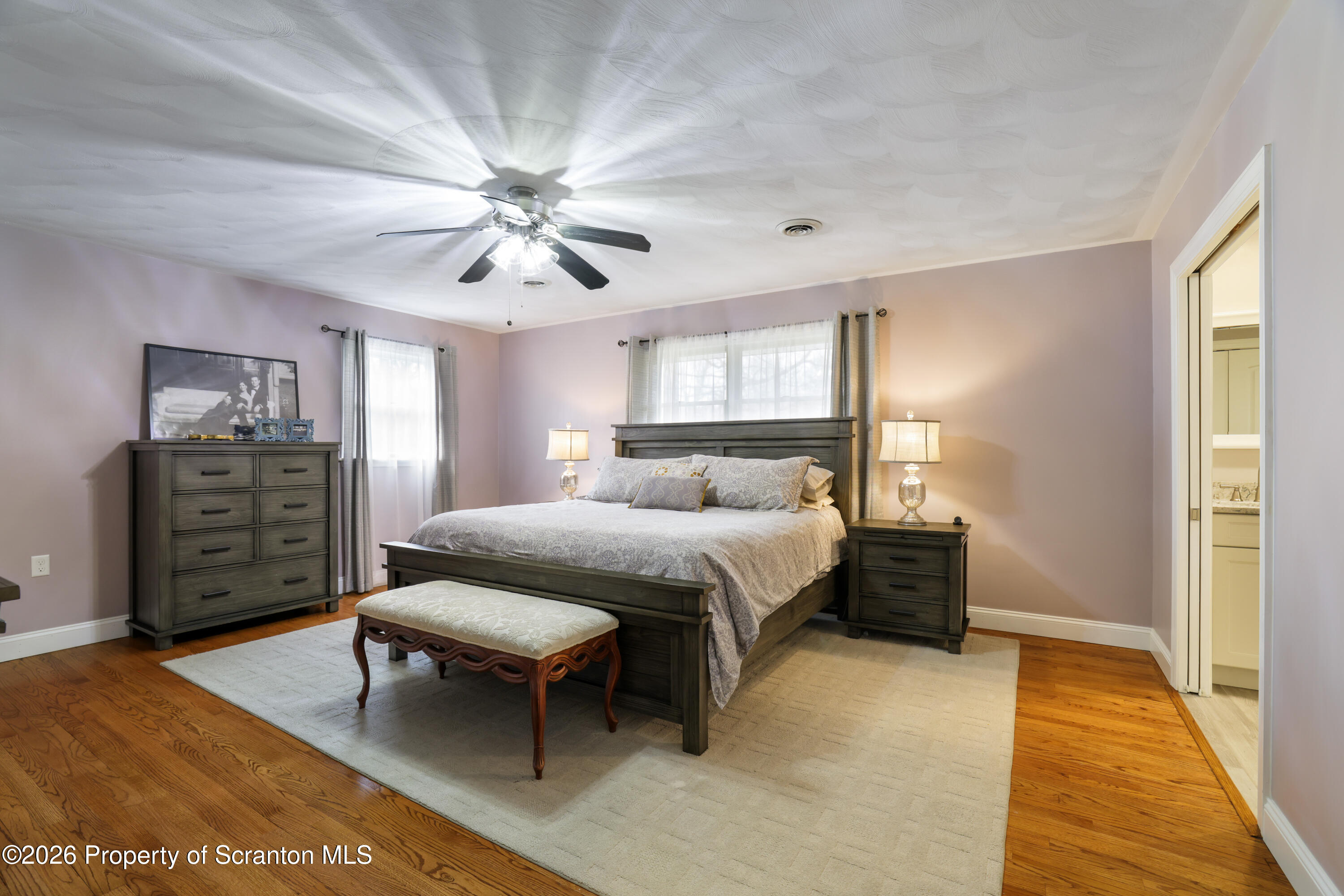 3 Old Mill Road Jermyn, PA 18433 - Photo 28 of 57 a bedroom with a bed a dresser and a chandelier