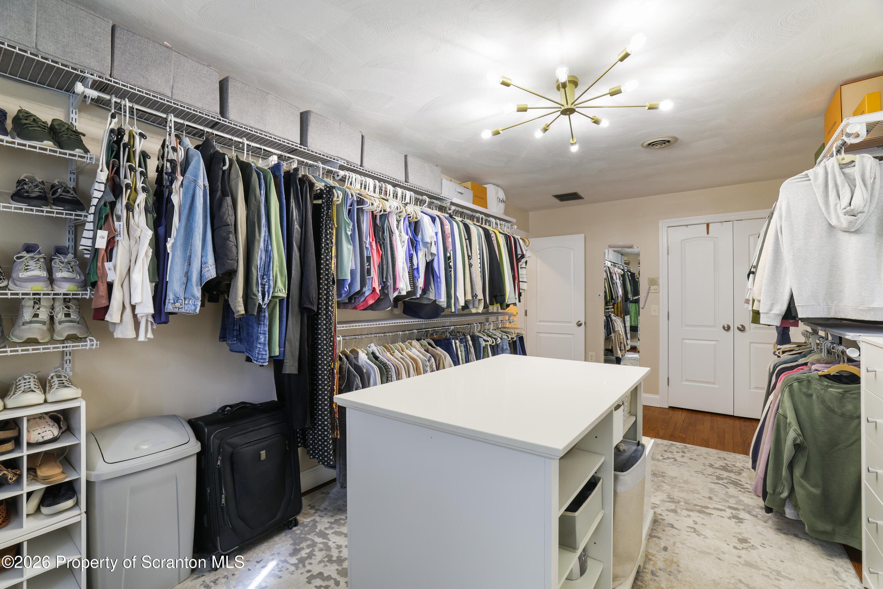 3 Old Mill Road Jermyn, PA 18433 - Photo 36 of 57 a view of walk in closet with clothes and shoes