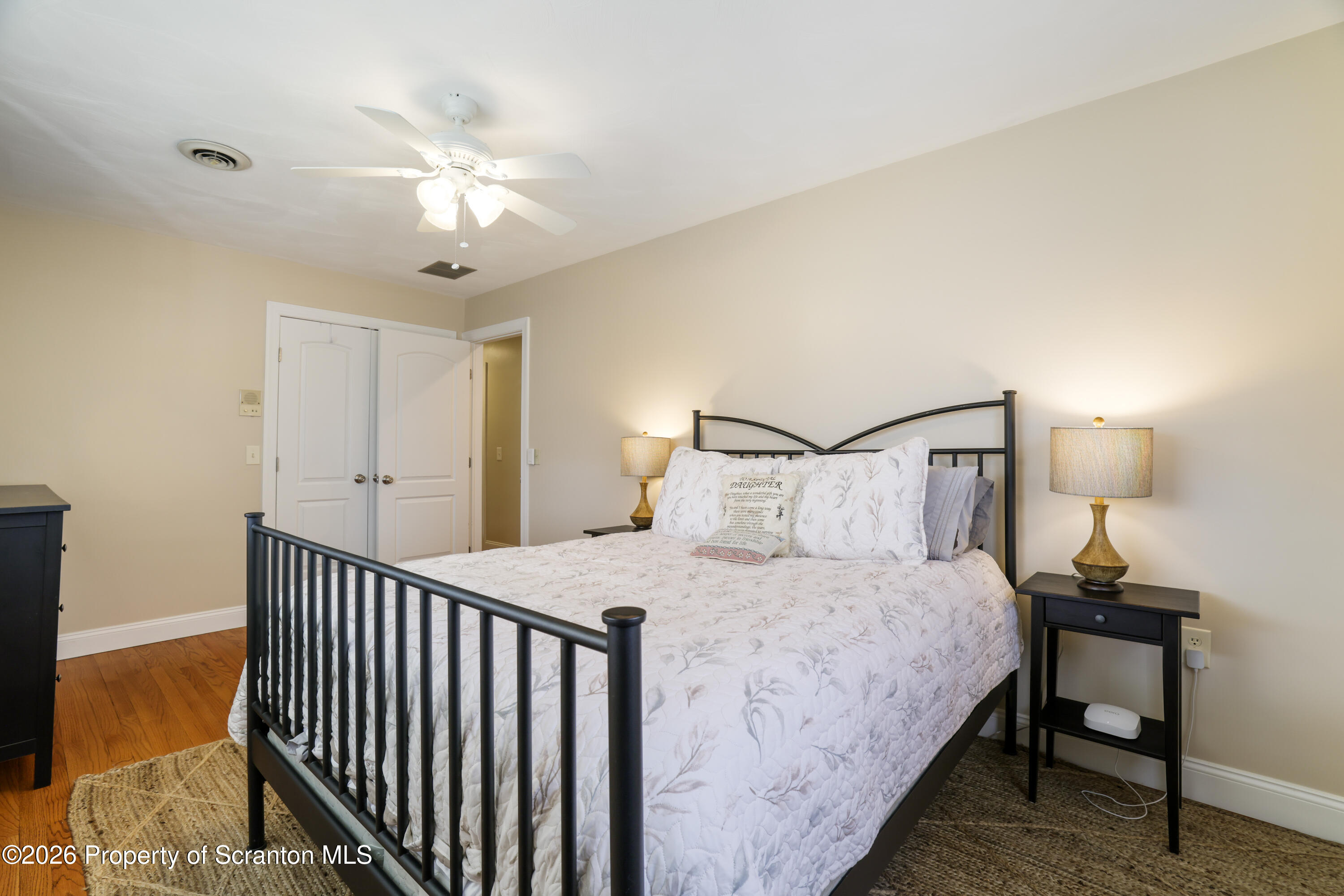 3 Old Mill Road Jermyn, PA 18433 - Photo 38 of 57 a bedroom with a bed and a chandelier