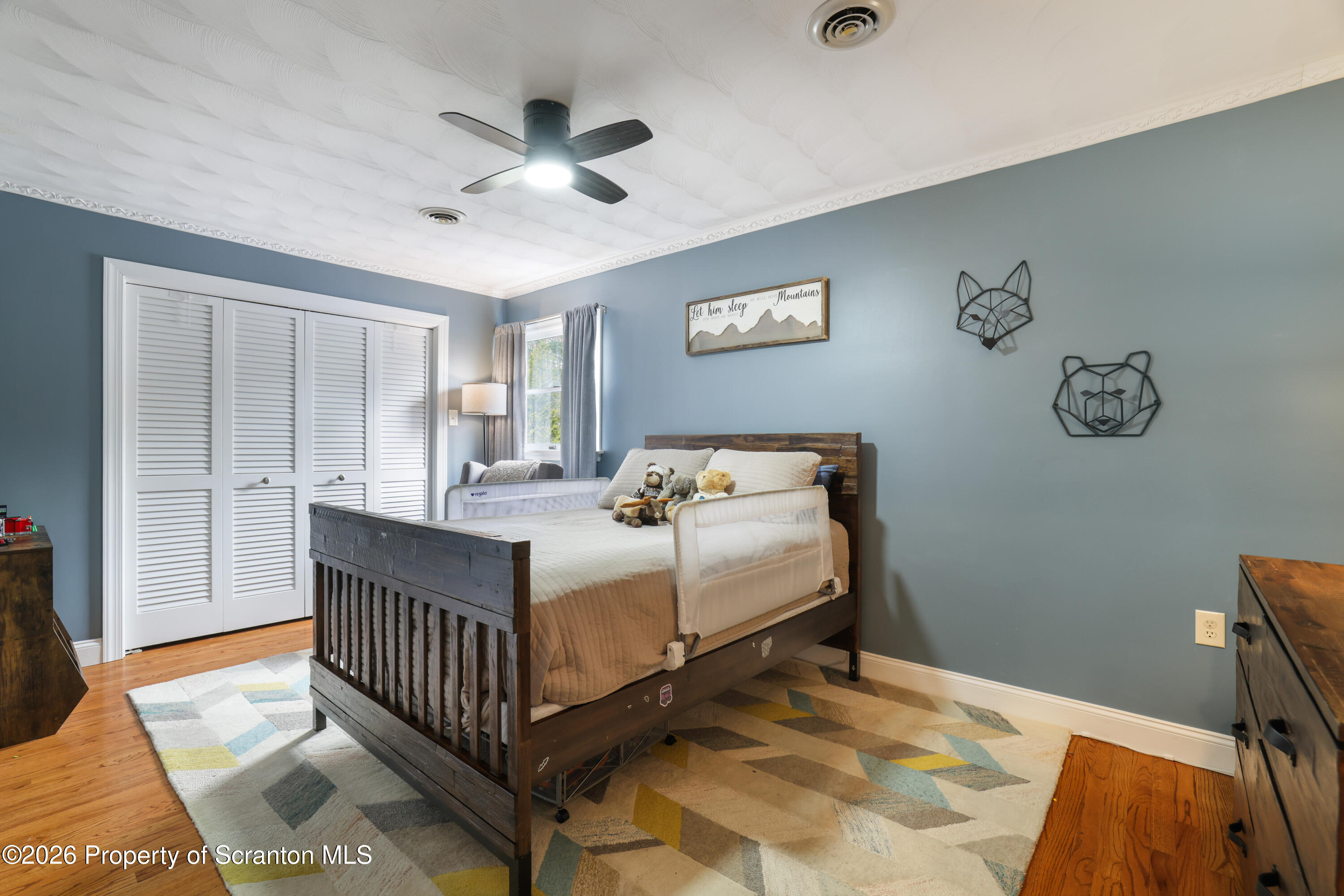 3 Old Mill Road Jermyn, PA 18433 - Photo 40 of 57 a bedroom with a bed and a chandelier
