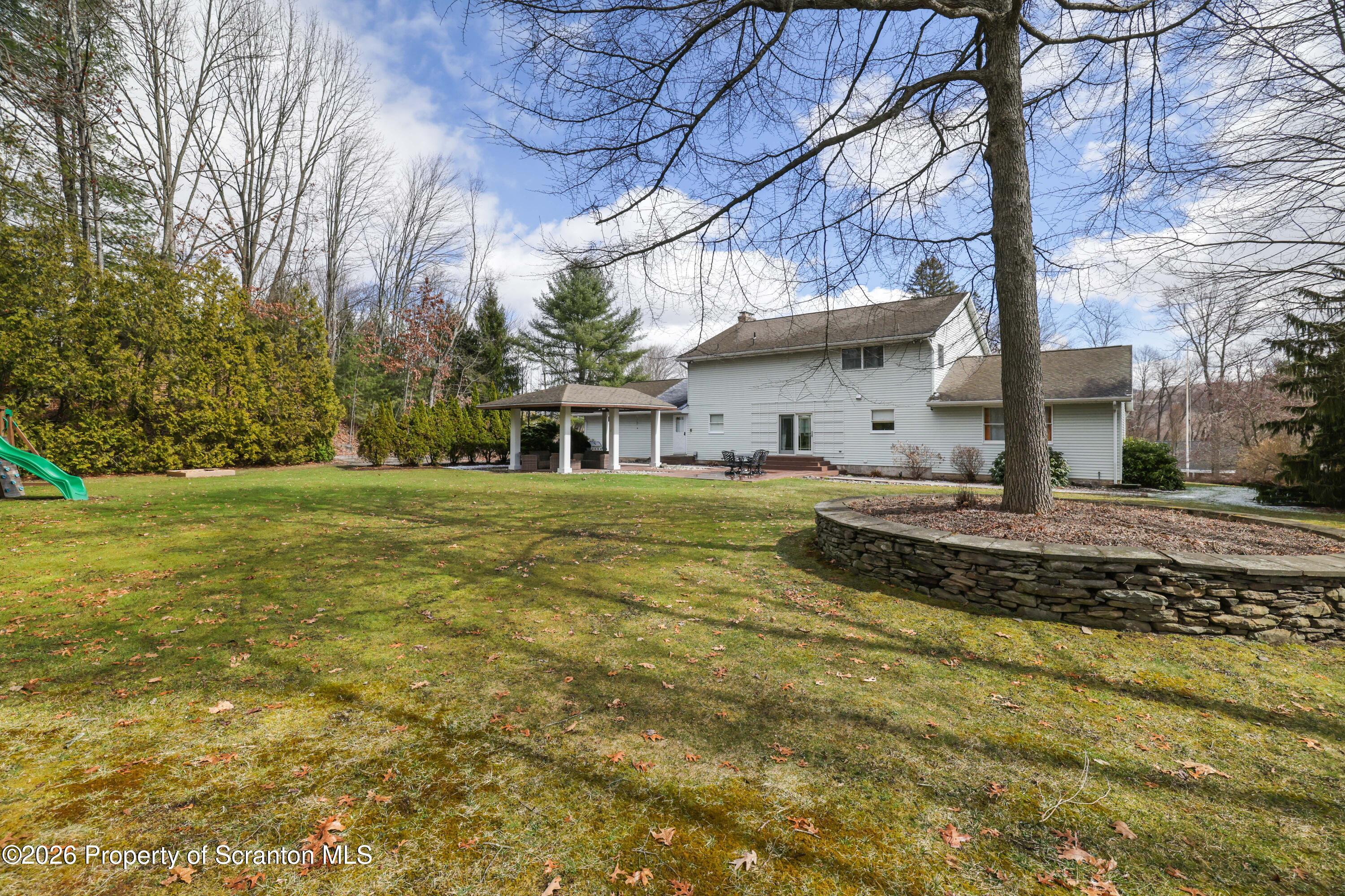 3 Old Mill Road Jermyn, PA 18433 - Photo 49 of 57 a view of a house with a yard
