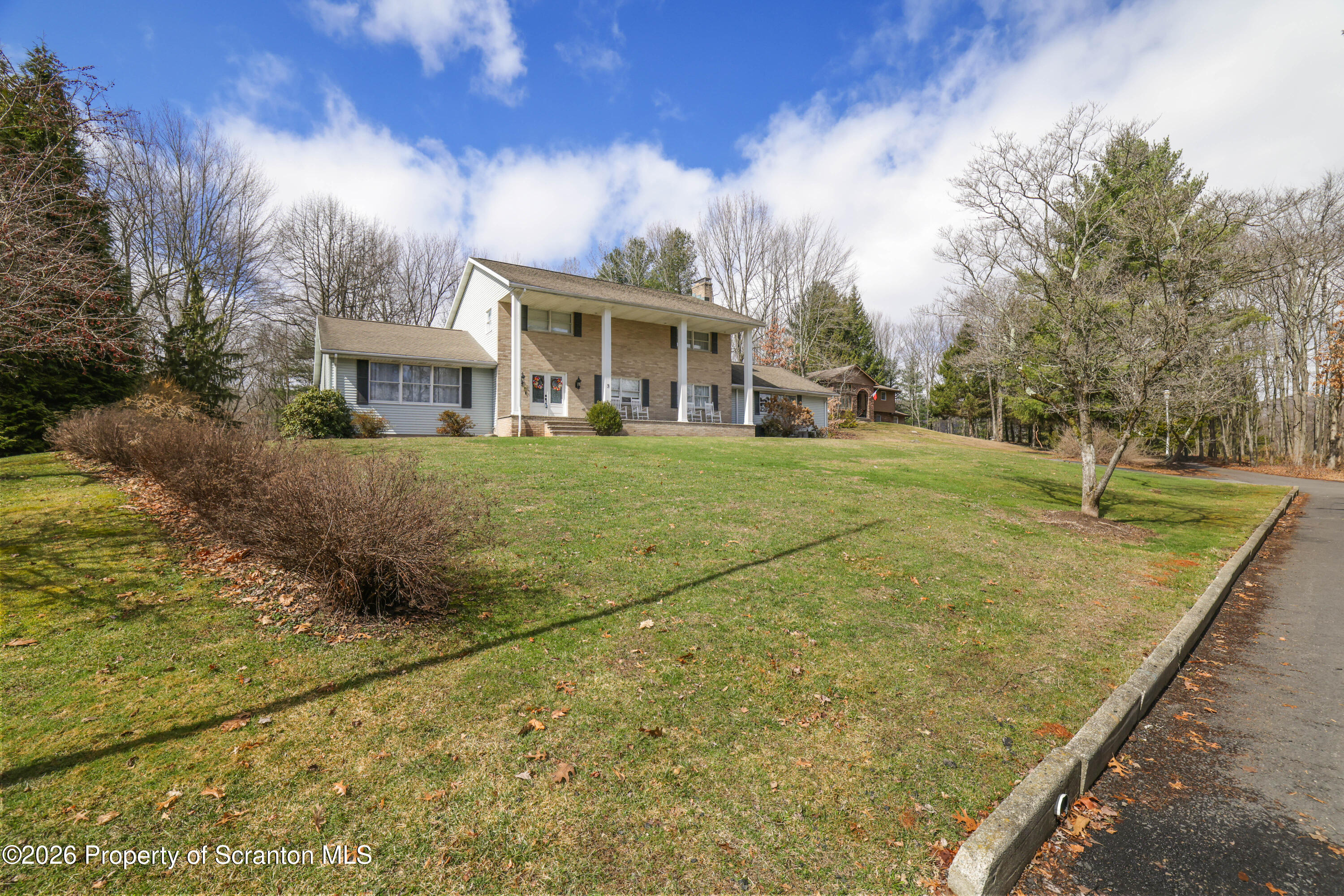 3 Old Mill Road Jermyn, PA 18433 - Photo 54 of 57 a front view of a house with a garden
