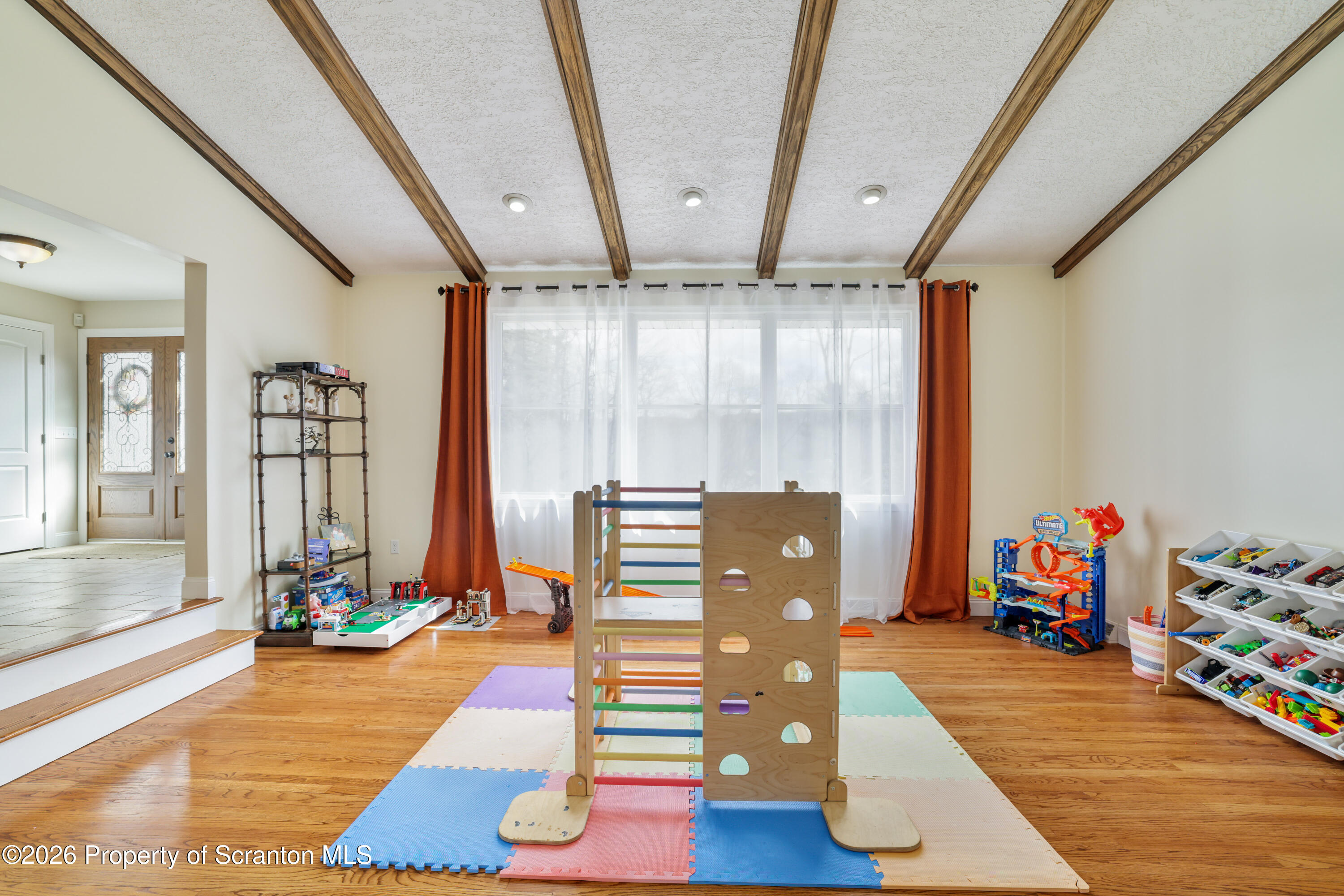 3 Old Mill Road Jermyn, PA 18433 - Photo 6 of 57 a room with lots of white furniture and wooden floor