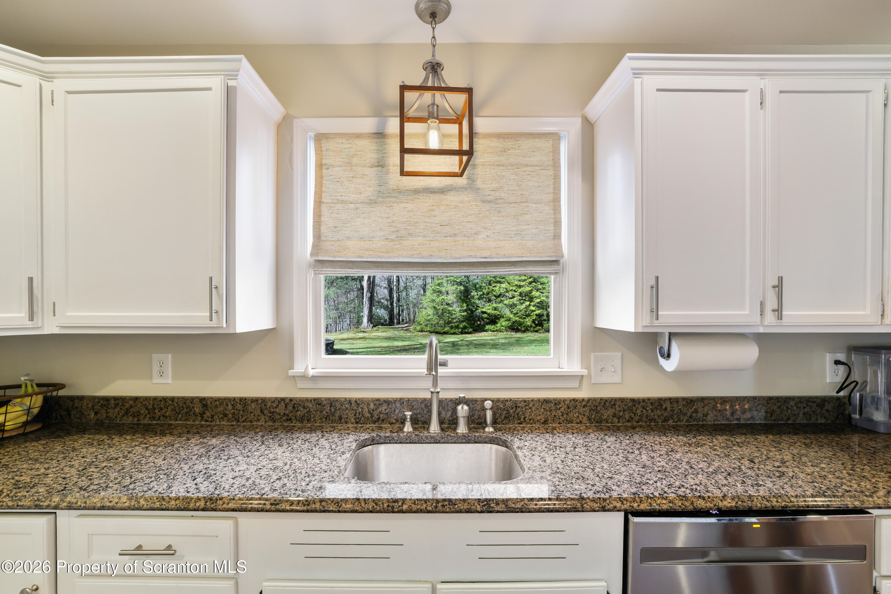 3 Old Mill Road Jermyn, PA 18433 - Photo 10 of 57 a kitchen with granite countertop a sink and a window