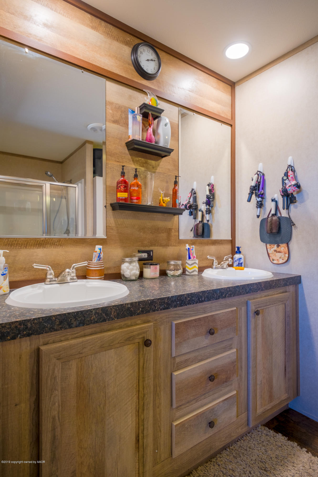 22300 Adkisson Road Canyon, TX 79015 - Photo 14 of 37 a bathroom with a sink and a mirror