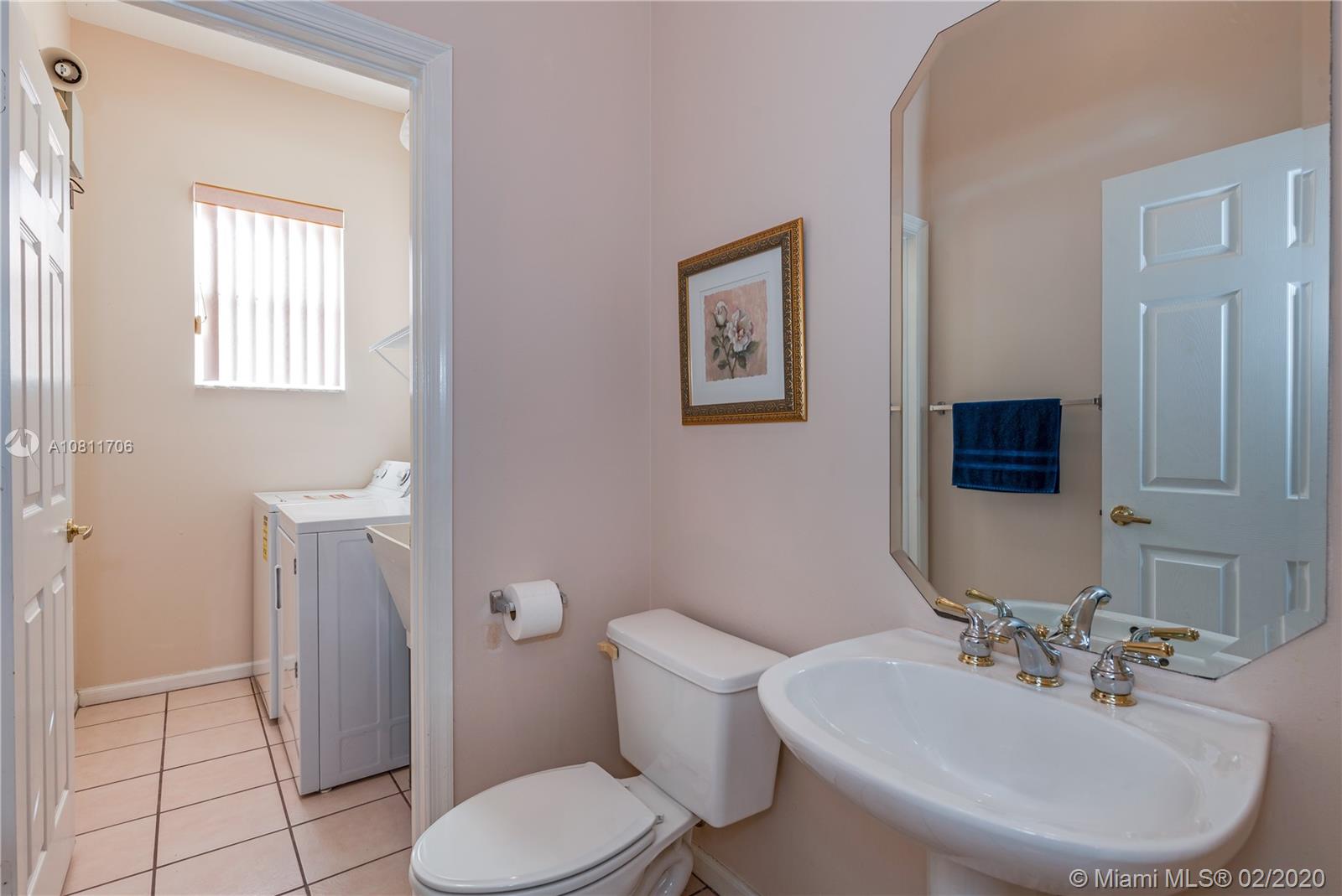 12420 Rockledge Circle Boca Raton, FL 33428 - Photo 29 of 44 Half Bathroom Laundry room