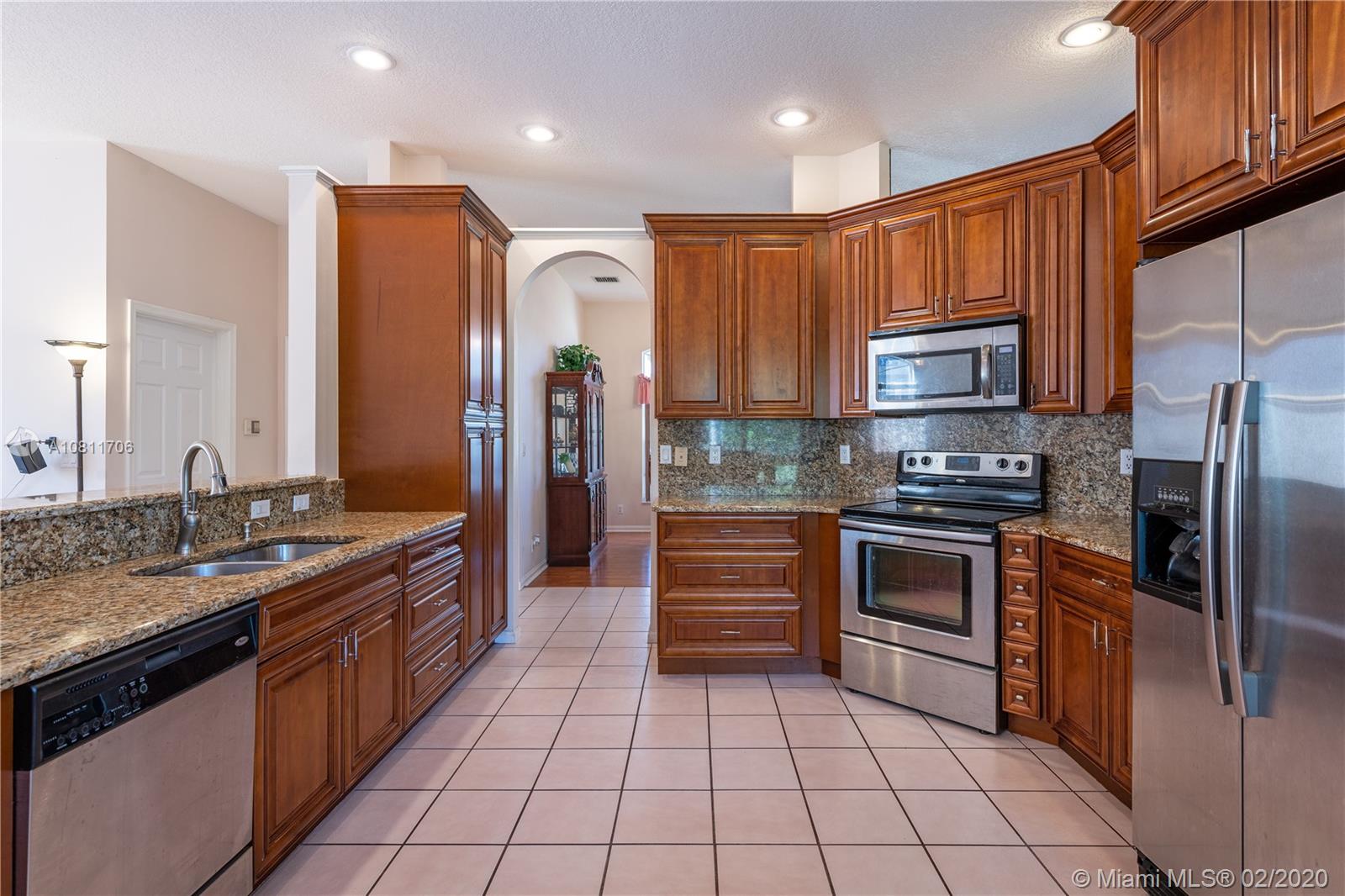 12420 Rockledge Circle Boca Raton, FL 33428 - Photo 10 of 44 Kitchen, Granite Counter, Wood Cabinet, Stainless Steel Appliances