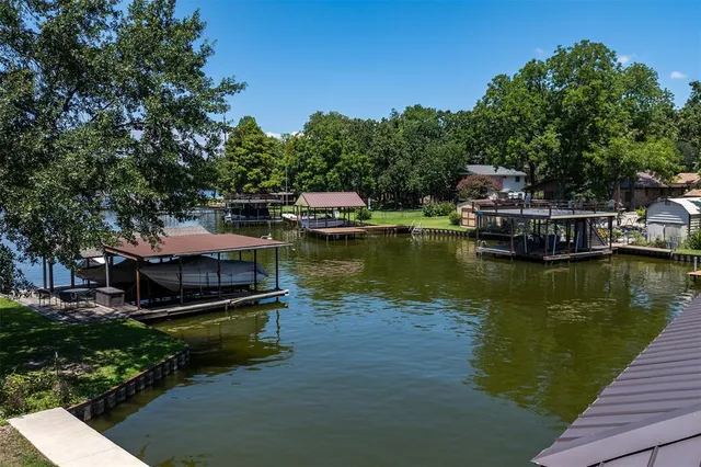 a view of yard with green space and seating area