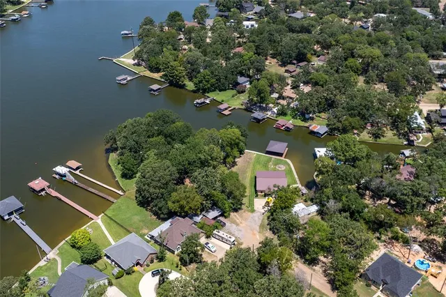 an aerial view of city and lake