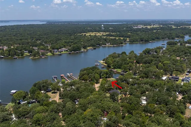 an aerial view of a houses with ocean view